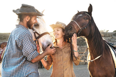 Friends standing in a horse