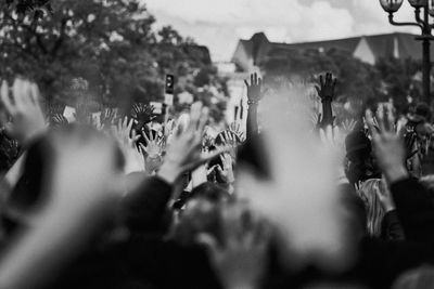 People with arms raised during protest