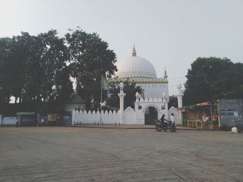 View of buildings in city against clear sky