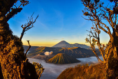 Scenic view of landscape against cloudy sky