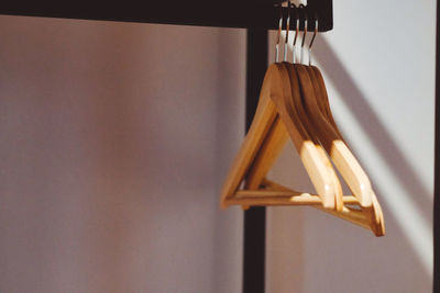 Coathangers hanging against wall at home