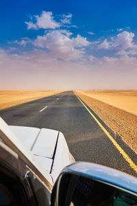 Road seen through car windshield