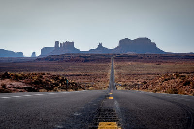 Road amidst landscape against clear sky