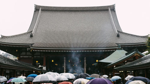 People at market stall in city