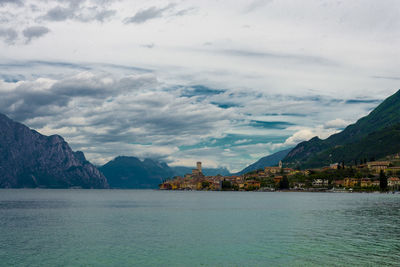 Scenic view of sea and buildings against sky