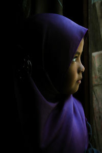 Close-up portrait of girl looking away