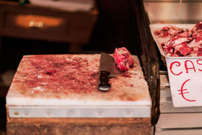 High angle view of knife and meats on table in market
