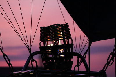 Low angle view of silhouette bridge against sky at sunset