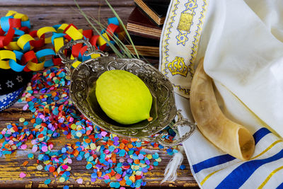 Jewish festival of sukkoth over paper colorful chain garland on kippah