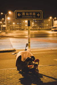 Text on street in city at night