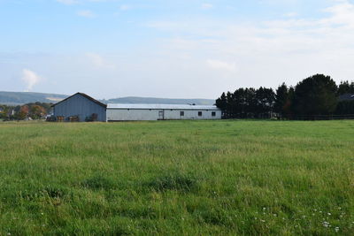 House on field against sky