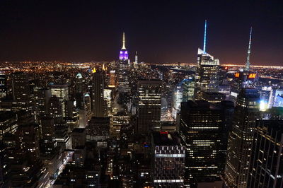 Illuminated buildings in city at night