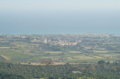 Aerial view of illuminated cityscape against sky