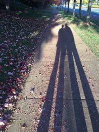 Woman walking on footpath