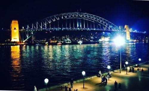 Bridge over river at night