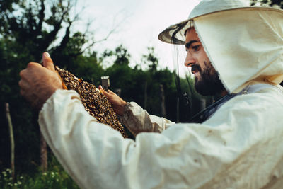 Midsection of man holding food