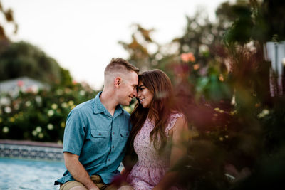 Husband & wife in rose garden in san diego