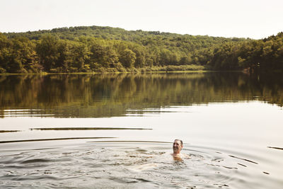 High angle view of man swimming in lake