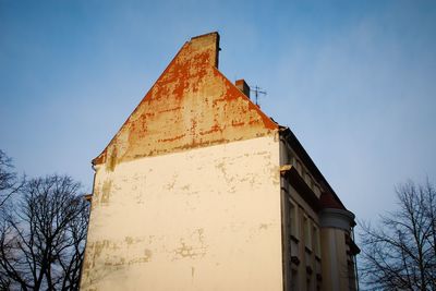 Low angle view of buildings against clear blue sky