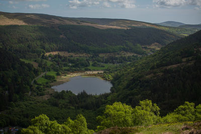 High angle view of trees and mountains against sky