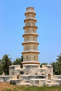 Low angle view of historical building against blue sky