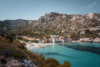 Scenic view of buildings and mountain against sky