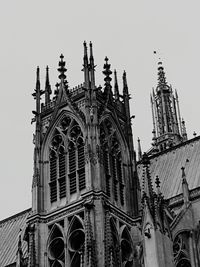 Low angle view of bell tower against sky