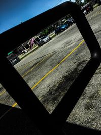 Close-up of car against sky in city