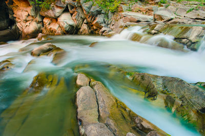 Stream flowing through rocks