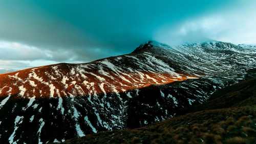 Scenic view of volcanic mountain against sky