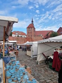 View of buildings in town against sky