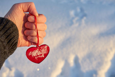 Close-up of hand holding heart shape
