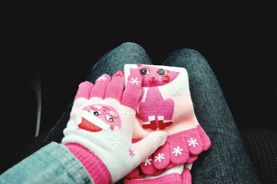 Close-up of woman hand holding pink hat