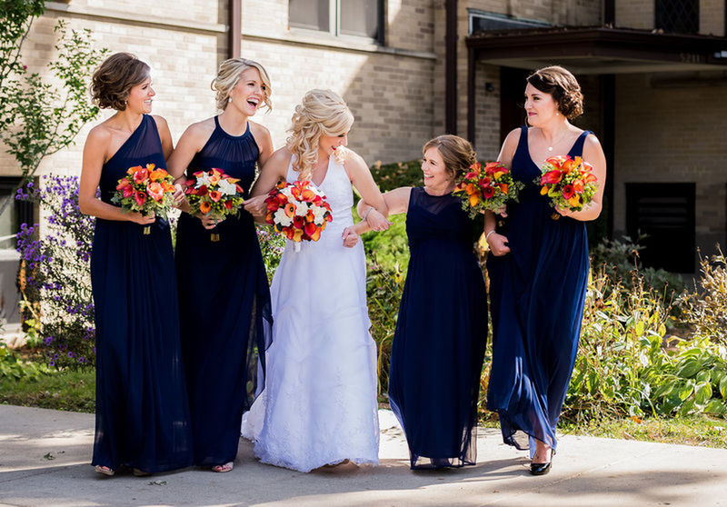 flower, togetherness, bouquet, life events, bride, happiness, wedding, full length, young women, young adult, women, standing, celebration, smiling, wedding dress, front view, friendship, day, mature women, mature adult, outdoors, real people, blond hair, adult, men, adults only, beautiful woman, only women, people