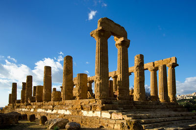 Low angle view of old ruins against sky