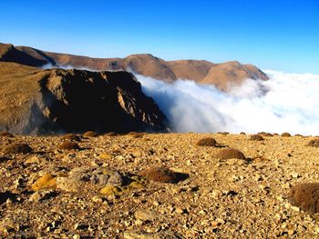 Scenic view of volcanic mountain against sky