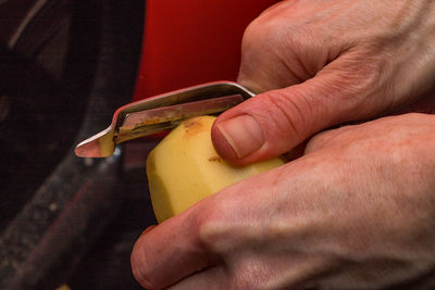 Close-up of man holding hands