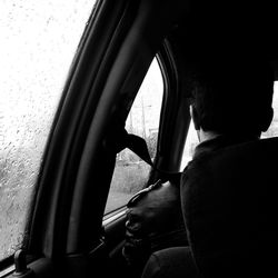 Man sitting in car