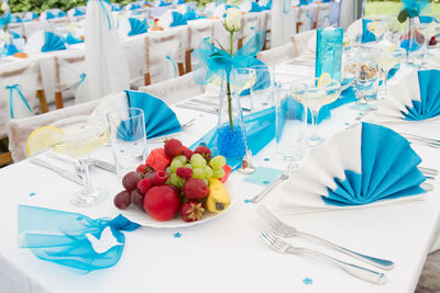 Luxury wedding lunch table setting outdoors, in white-blue colors
