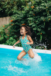 Young woman swimming in pool