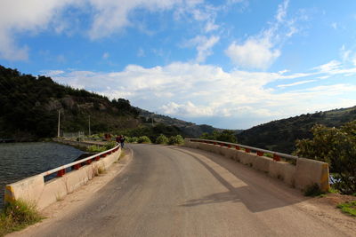 Empty road with mountain in background