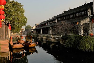 Arch bridge over canal against sky