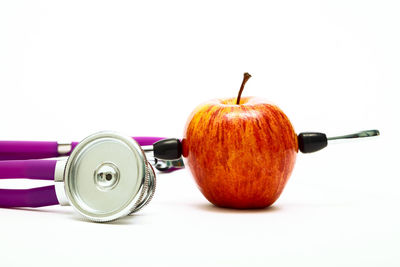 Close-up of apple against white background