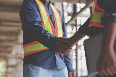 Midsection of man working at construction site