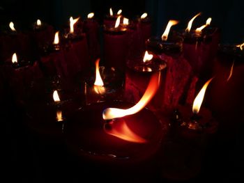 Close-up of lit tea light candles