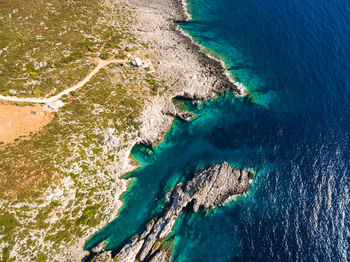 Aerial view of rock formation in sea