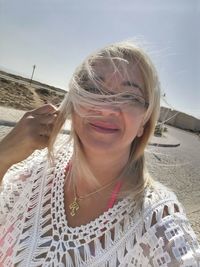 Portrait of a smiling young woman on beach