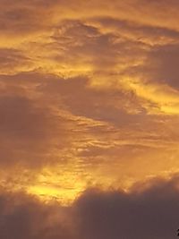 Low angle view of dramatic sky during sunset