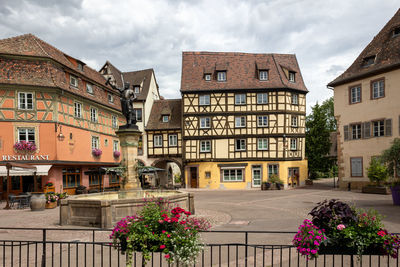 Buildings in city against sky