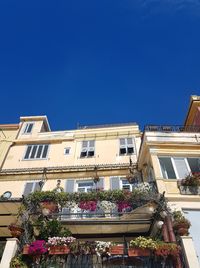 Low angle view of building against blue sky